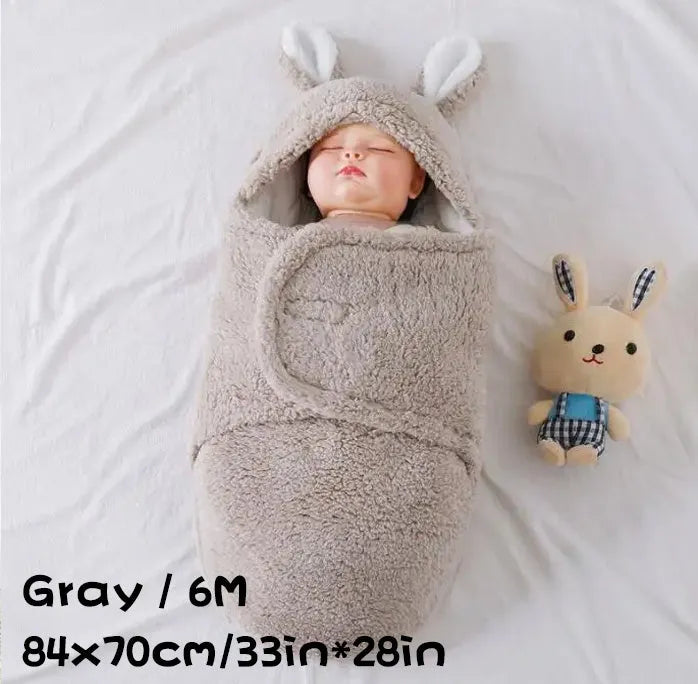 Adjustable baby sleeping bag swaddle blanket showing velcro wings and leg positioner in blue colour