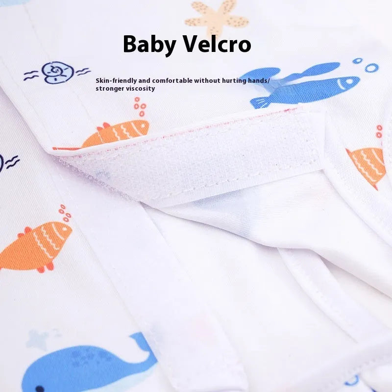 Cat wearing sterilisation recovery suit with Velcro closure in colourful print design