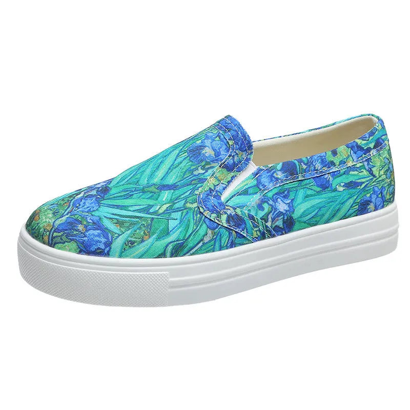 Women's blue low-top canvas sneaker with flat rubber sole on a plain background.