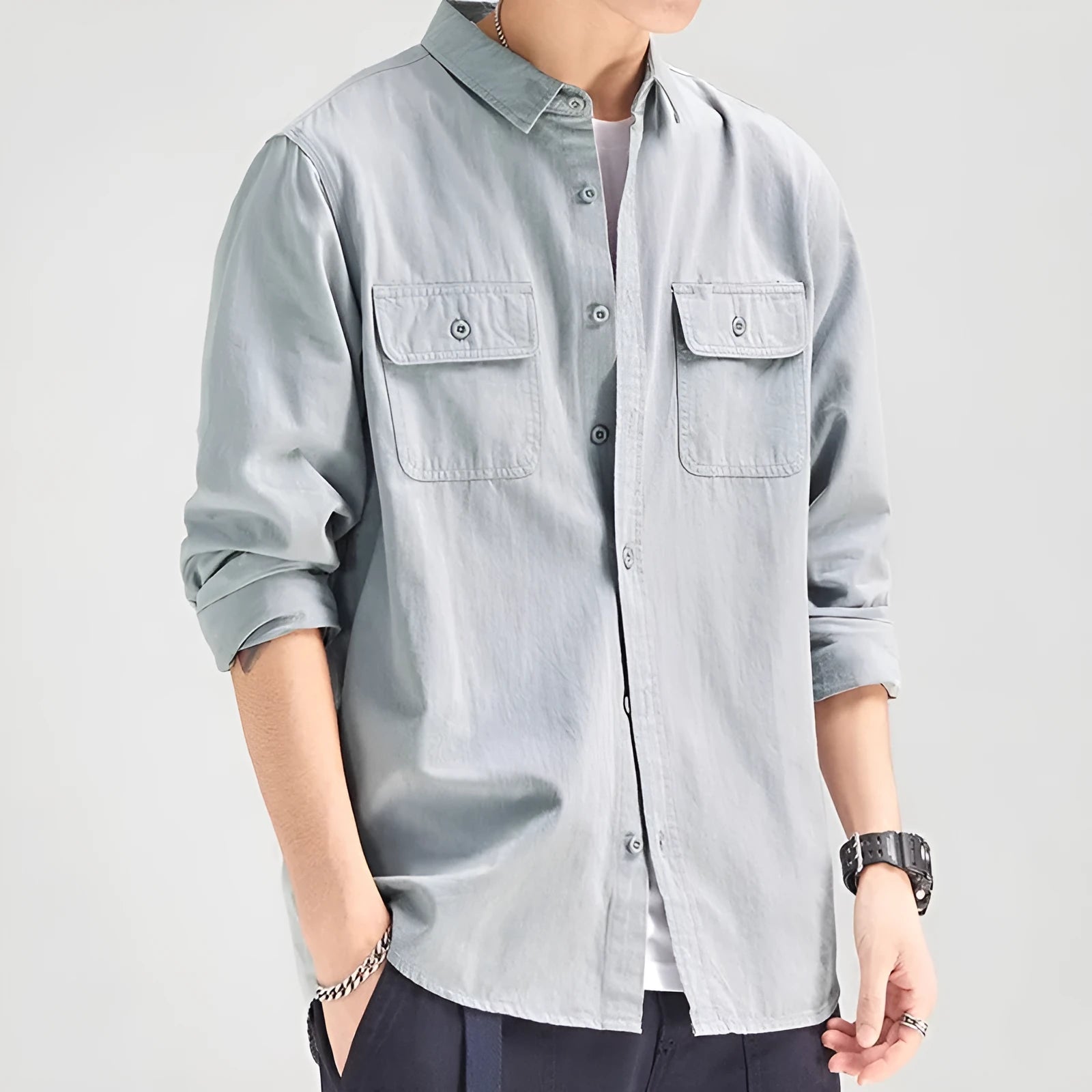Men's light grey loose fit long sleeve overalls shirt with cardigan style on a hanger