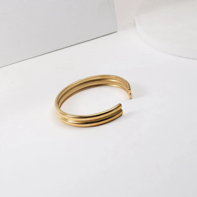 Double curved titanium steel bracelet for women, gold with pearl inlay, geometric style
