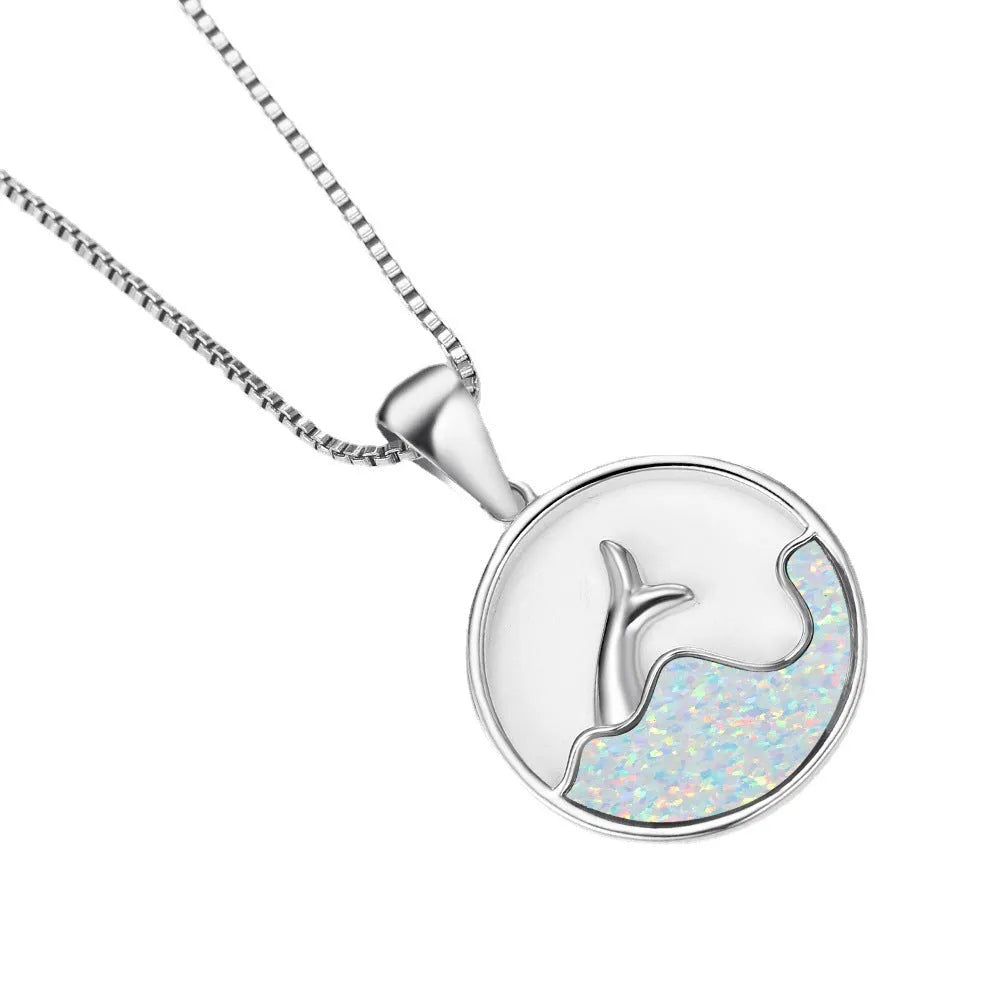 Geometric sea fishtail pendant necklace with a round blue opal and white gold electroplated finish.