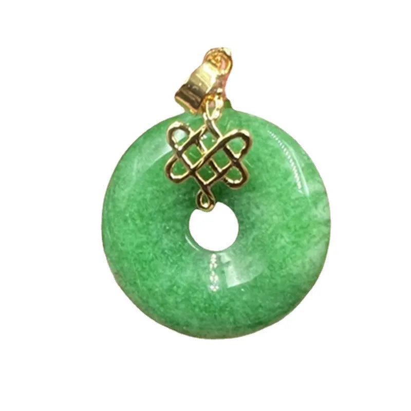 Dry green jade coin buckle pendant 25mm diameter on a light background