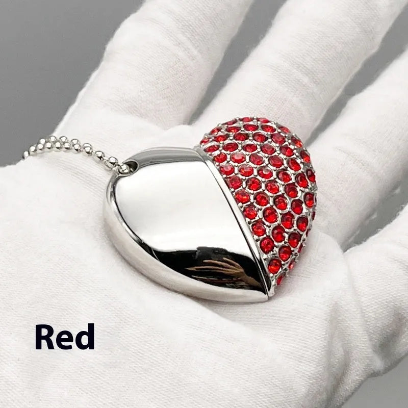 Blue metal USB flash drive with a brick-inlaid heart-shaped design, showing scale.