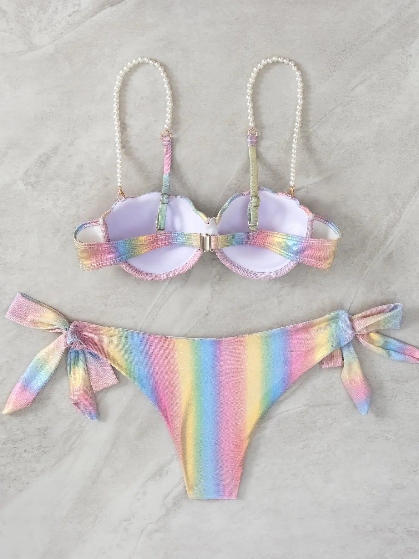 Women's rainbow coloured split tied bikini swimsuit on mannequin