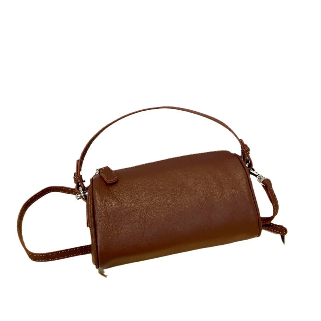 Soft vegetable tanning leather cylindrical crossbody phone bag in six colour options on a white background.
