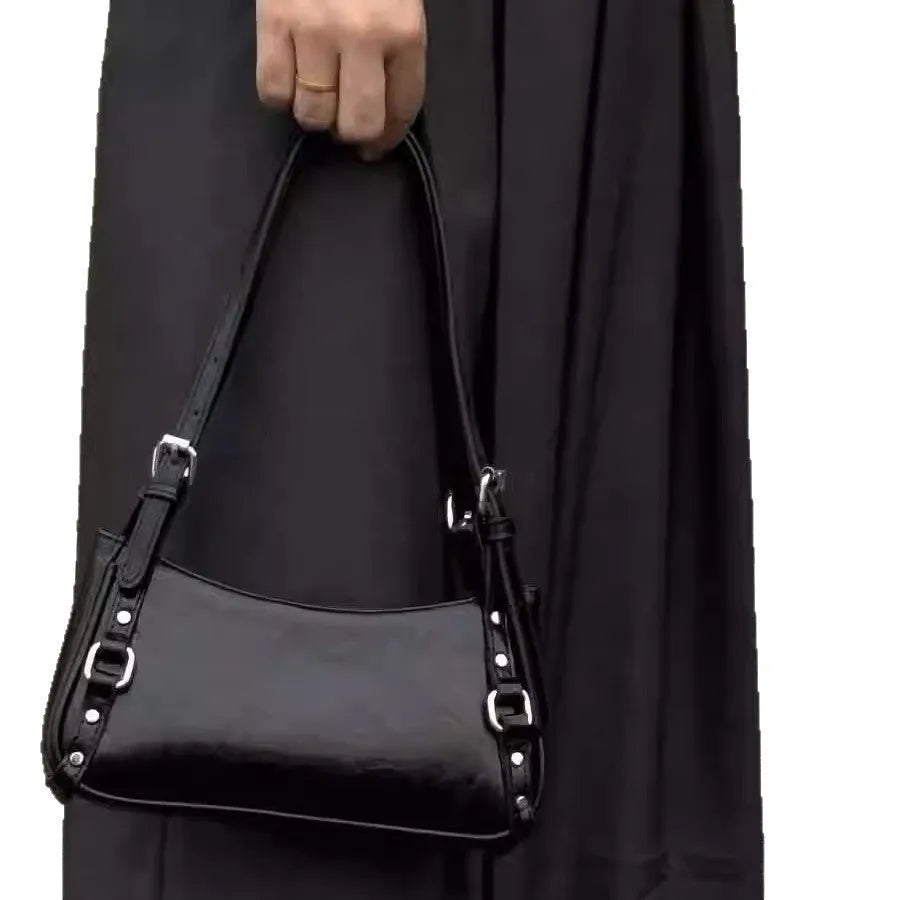 Black PU shoulder bag with horizontal square shape, outer three-dimensional pocket, and internal zipper change bag.