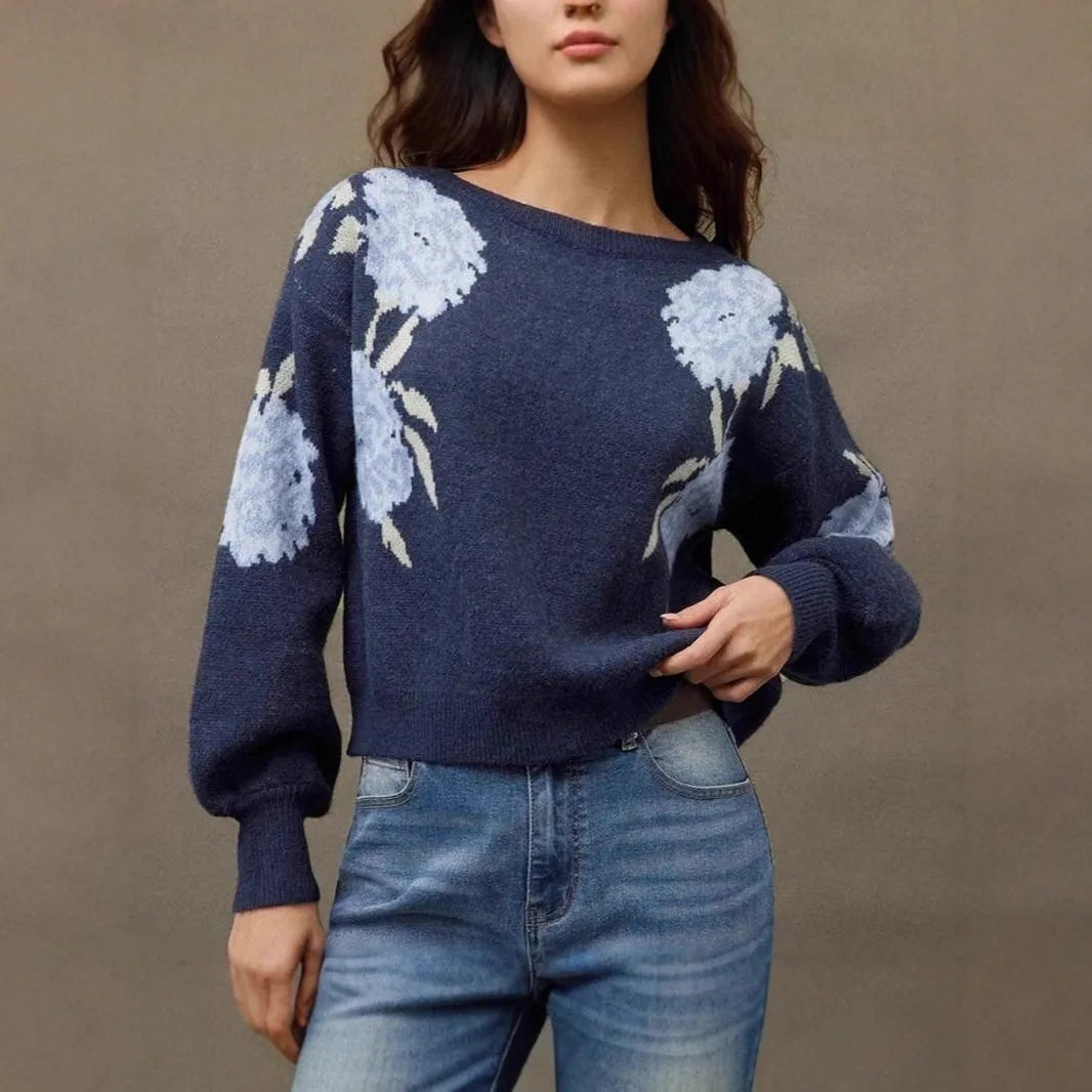 Sapphire blue women's loose pullover with a white floral jacquard pattern, off-neck design, and long sleeves.