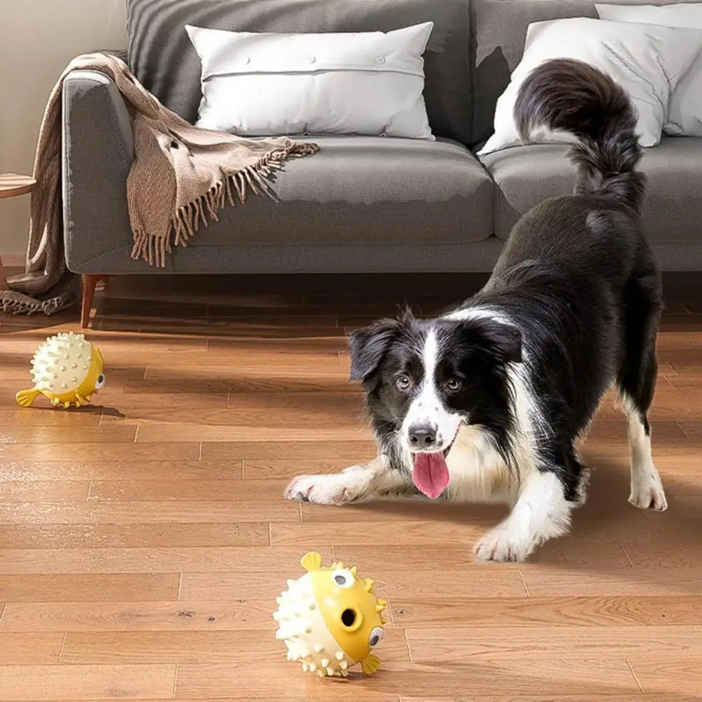 Yellow vinyl fish-shaped dog chew toy with textured surface for tough chewing and dental care.