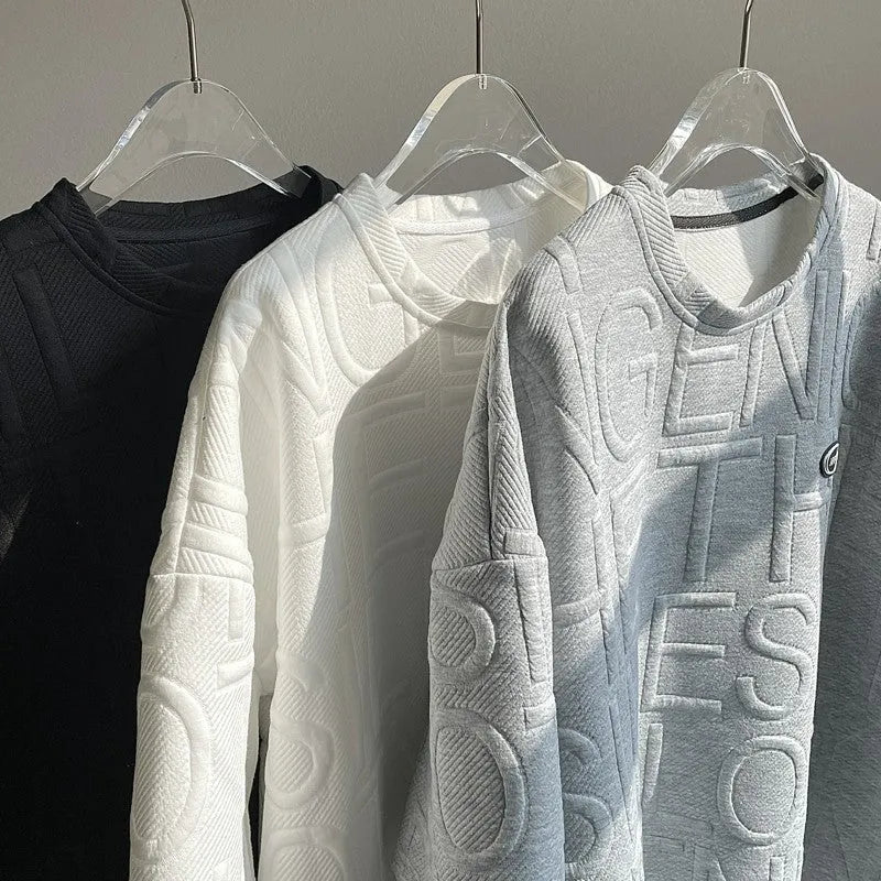 Grey men's loose t-shirt with a raised white 3D letter graphic on the chest.