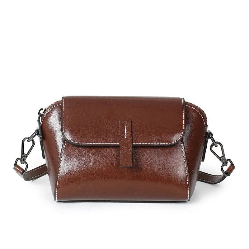 Women's soft oil wax cowhide shell messenger bag in avocado green with cross-body strap and visible stitching