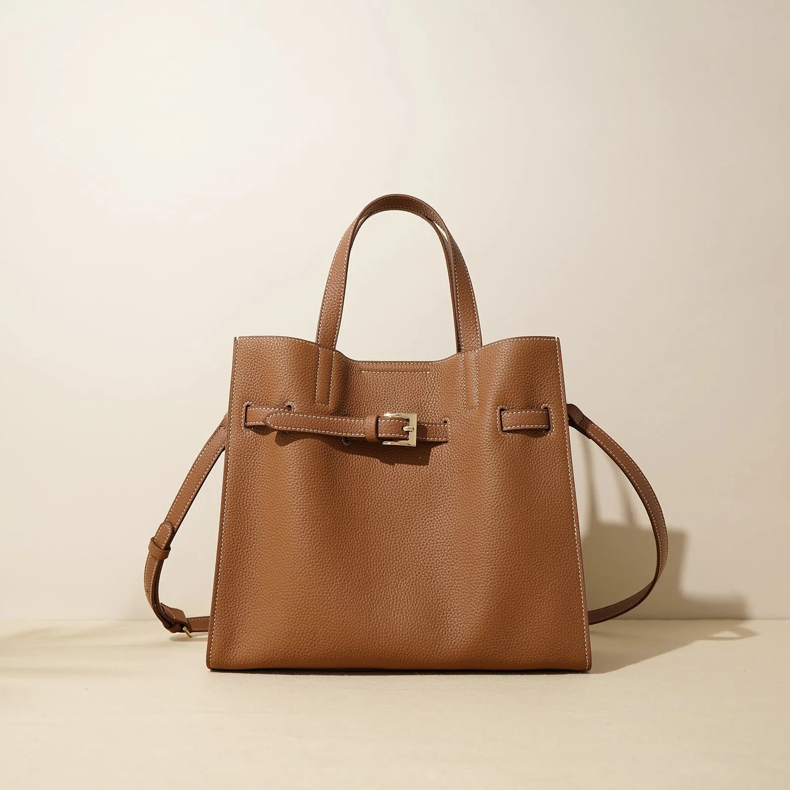 Genuine leather crossbody commuter bag in Toffee Gold with double shoulder straps and square vertical shape