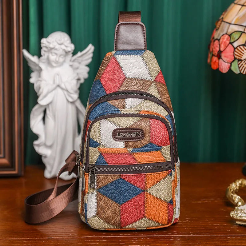 Color block PU leather crossbody bag with three-dimensional outer pocket and visible stitching detail