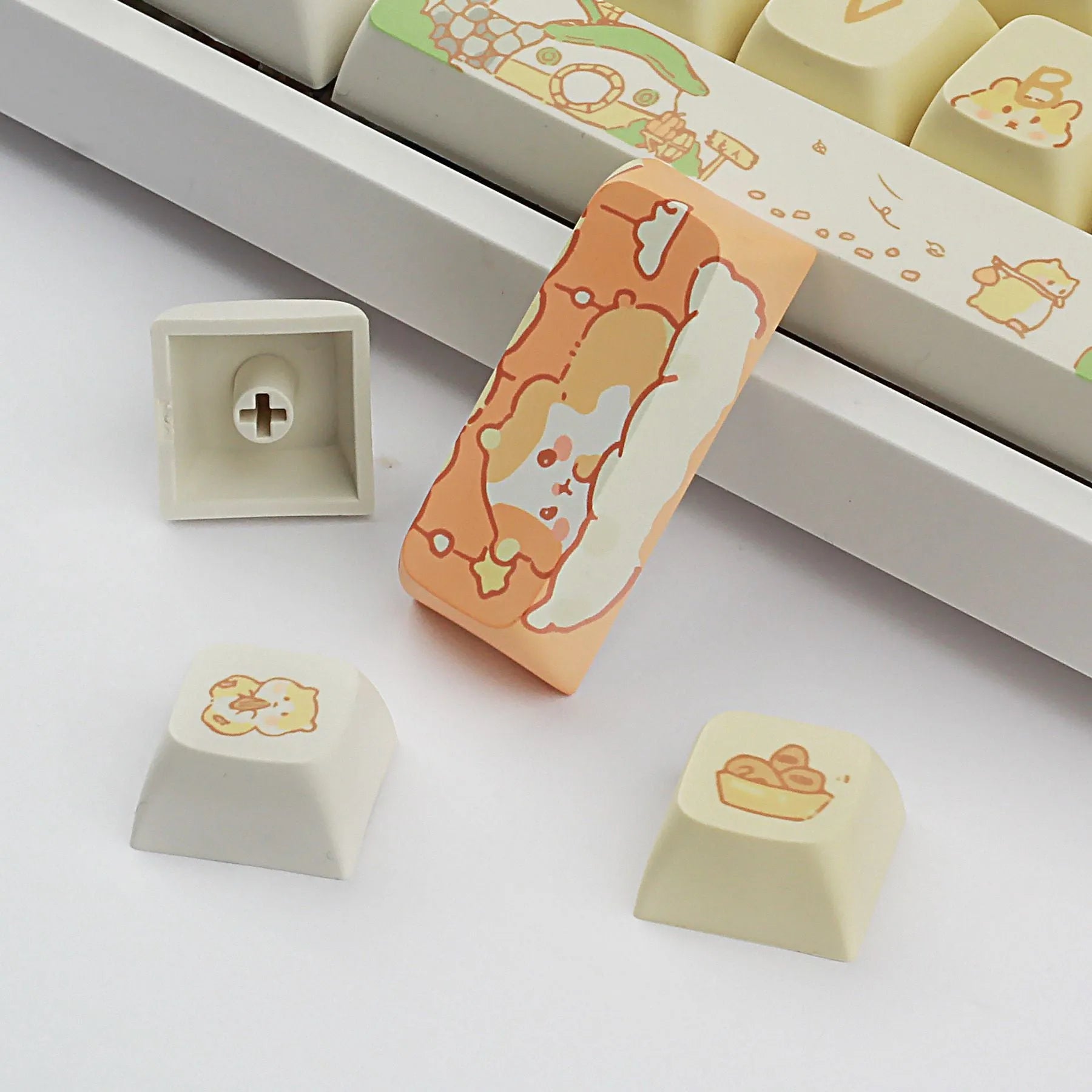 Custard yellow and soft grey XDA profile plastic keycap sets for mechanical keyboards.