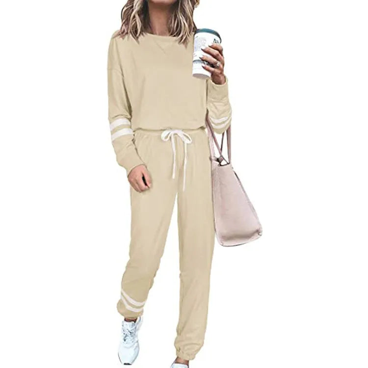 Women's loose-fitting casual suit in solid colour, showing long sleeve top and trousers in cotton blend fabric.