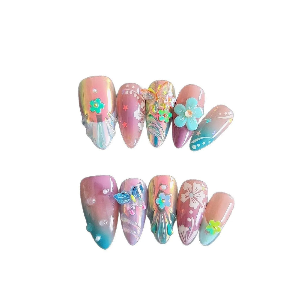 Handmade colourful false nails with 3D embossed flowers and butterflies on almond-shaped nails