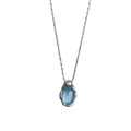 Navy blue water drop pendant necklace with platinum-coloured copper chain on display