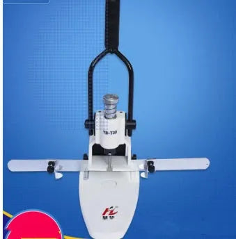 T30 single hole punching machine on desk with paper stack and adjustable pitch guide