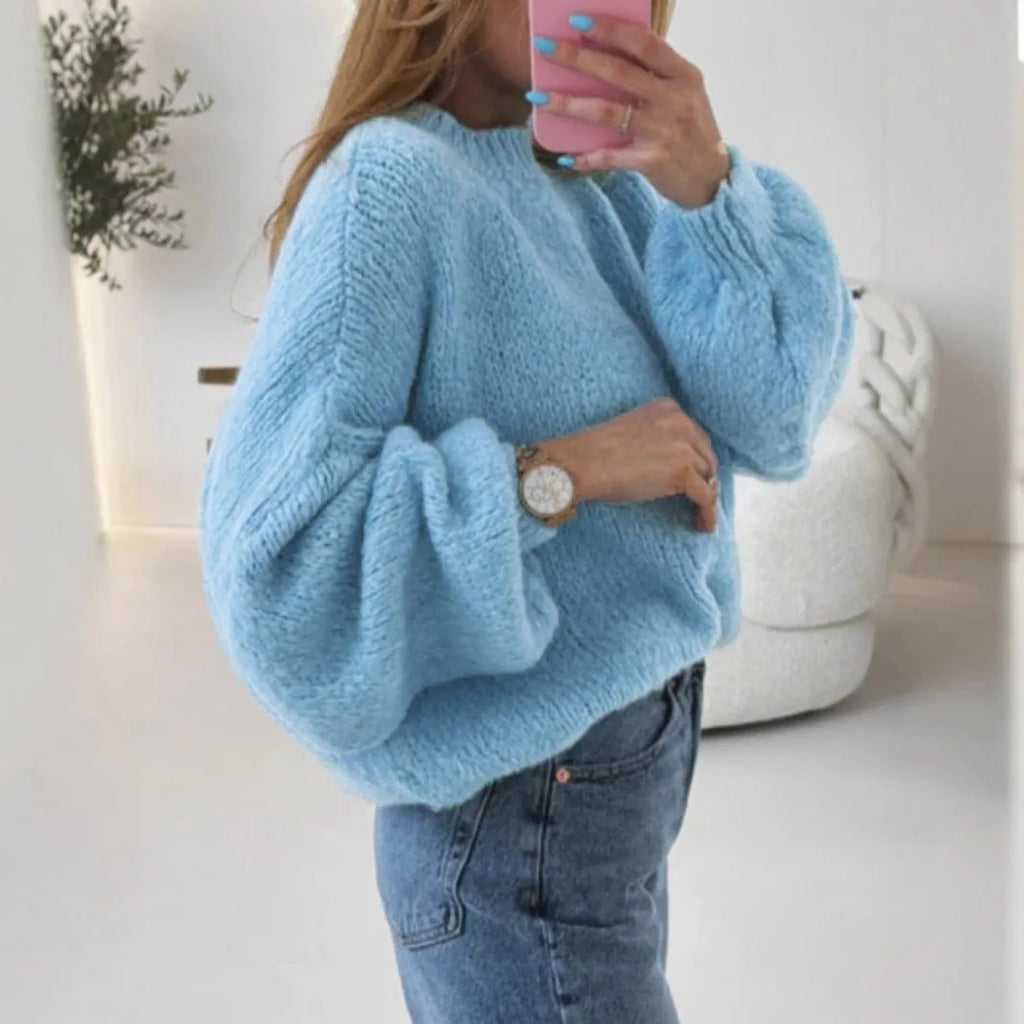 Blue round neck pullover sweater with long sleeves and loose fit, available in sizes S to XL.