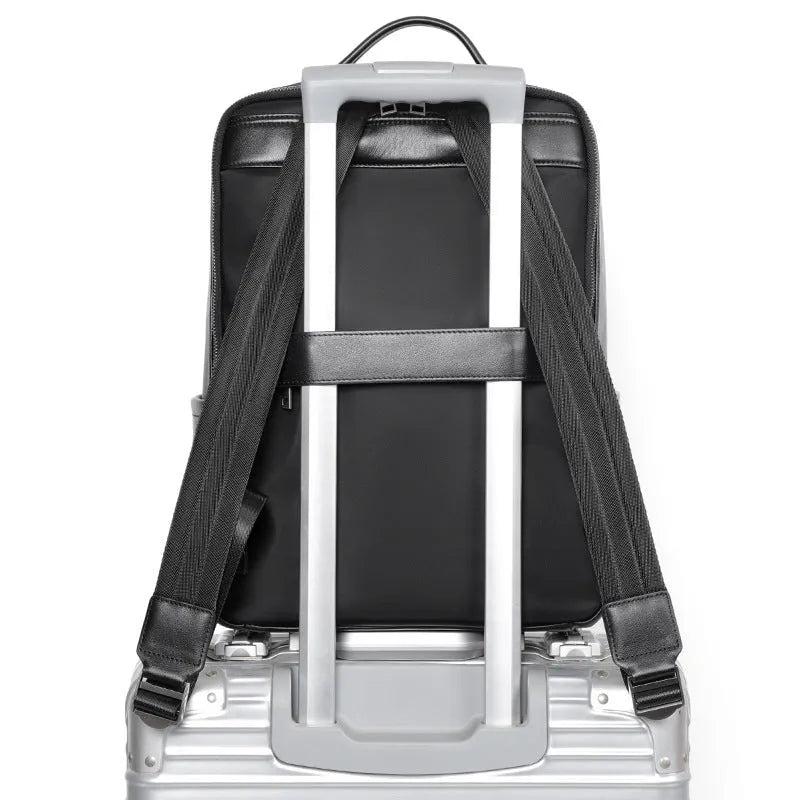 Men's black genuine leather computer backpack with 36-55 litre capacity and business styling