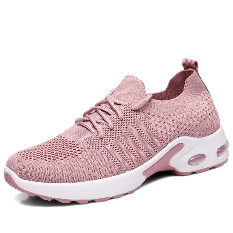 Women's black mesh casual sneakers with lace-up front and round toe on a soft PVC sole.