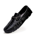 Men's black casual leather shoes with a silver buckle strap on a flat rubber sole.