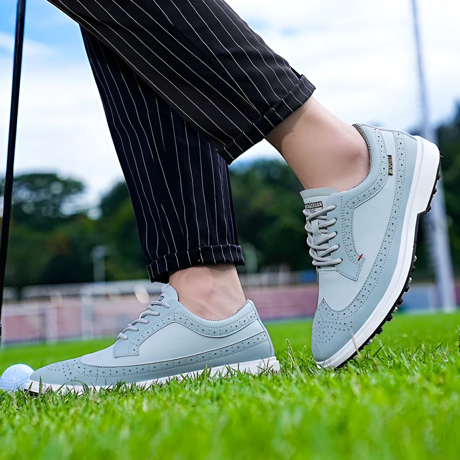 Men's lightweight golf shoes in Lake Blue with a genuine leather upper and rubber outsole.