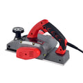Red desktop electric wood planer with aluminium body, showing 82mm planing width