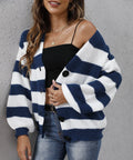 Blue striped women's cardigan with button front and deer plush textured fabric on a hanger.