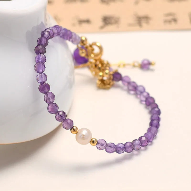 Chinese style amethyst colour crystal bracelet for women with diamond-shaped beads.