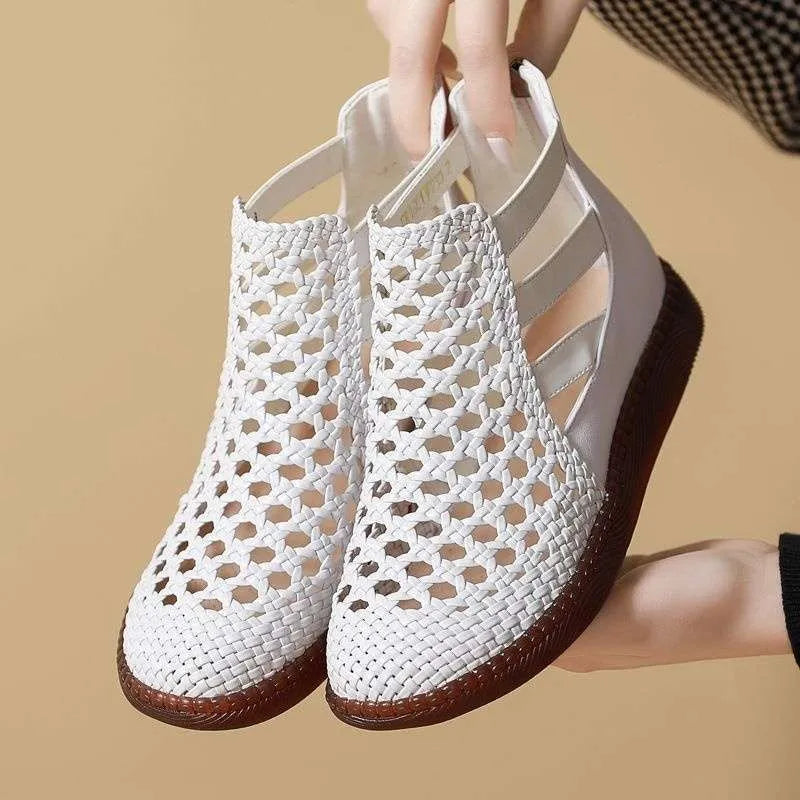 Women's flat sandals with hollow-out design and round toe in gold colour on white background