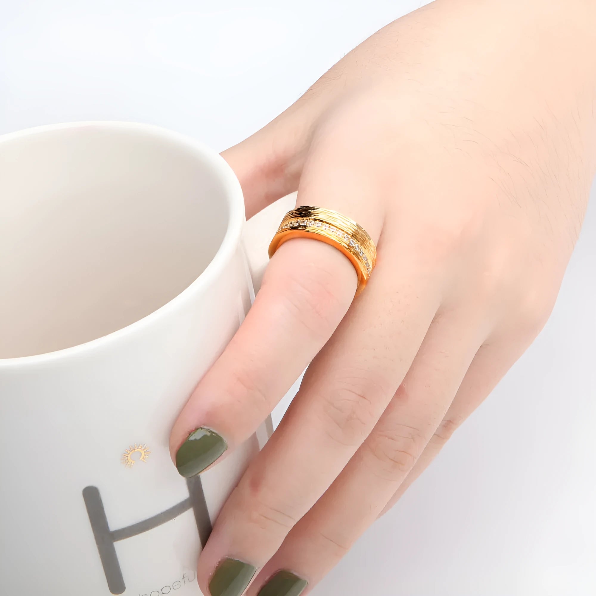 Gold geometric women's zircon ring on a white background, showing size options L, M, N.