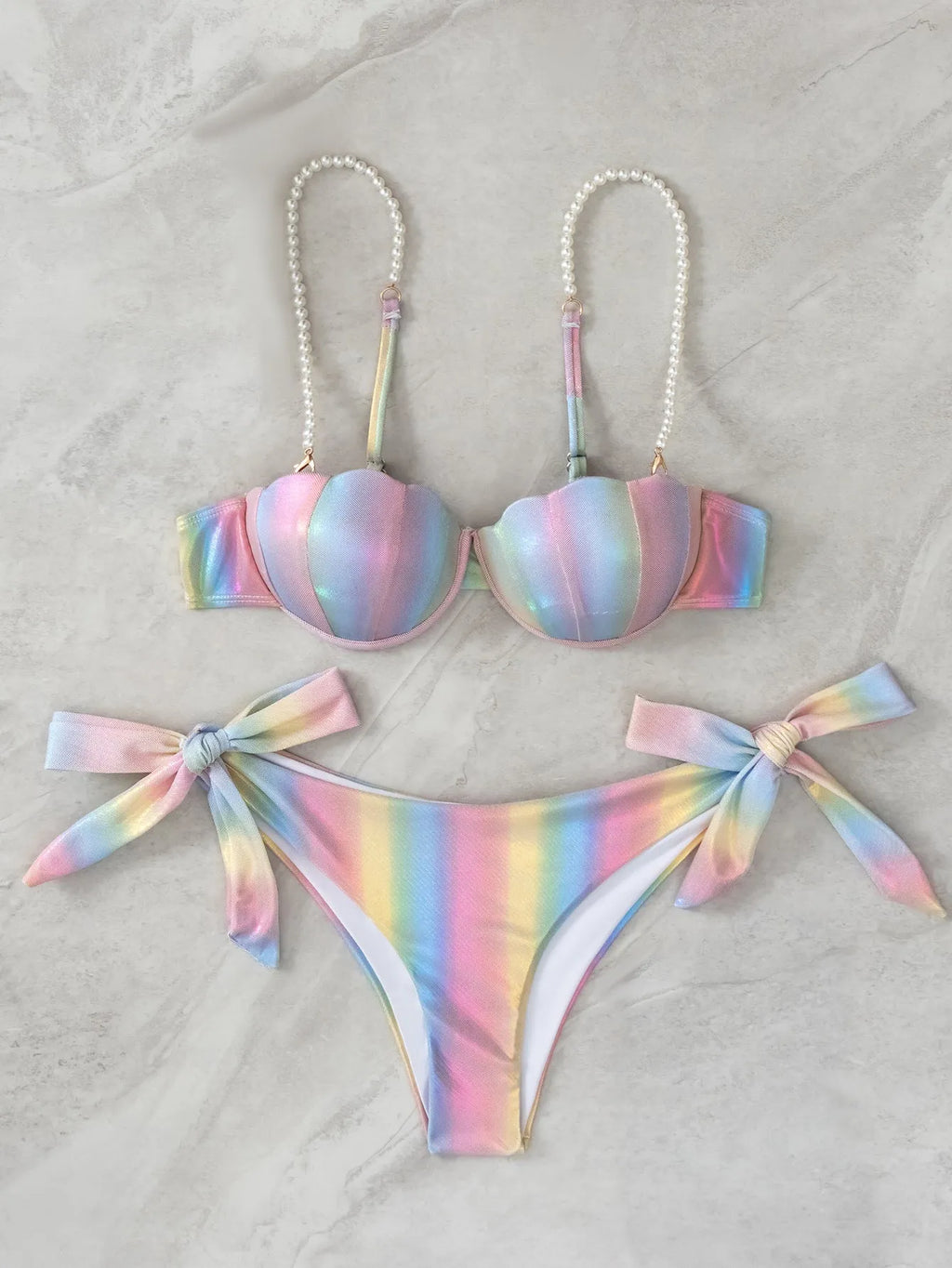 Women's rainbow coloured split tied bikini swimsuit on mannequin