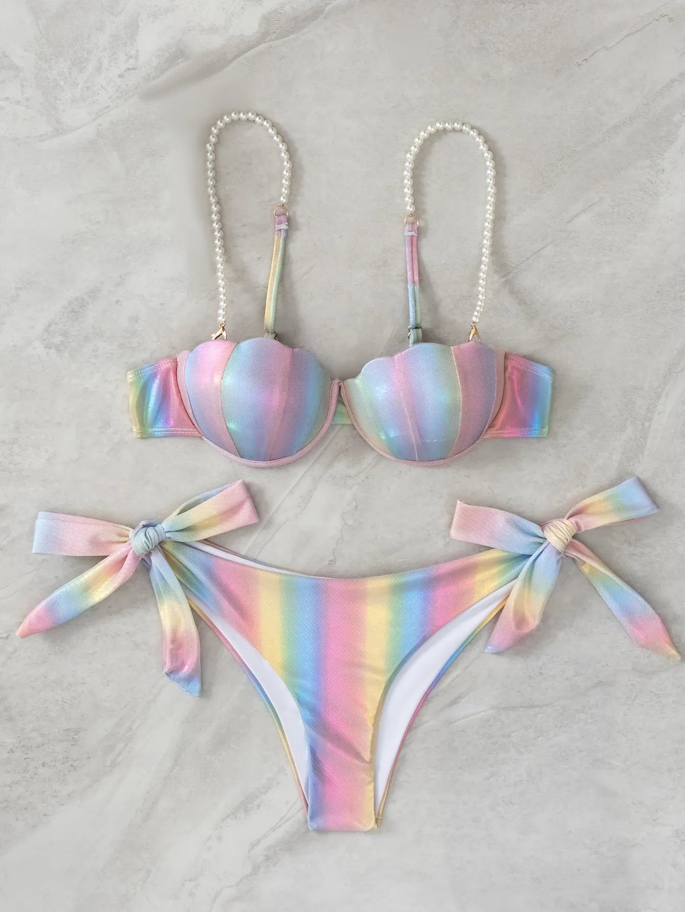 Women's rainbow coloured split tied bikini swimsuit on mannequin
