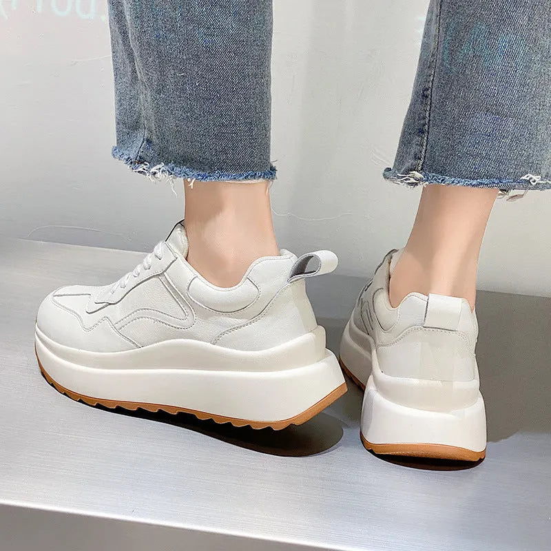 Women's beige cowhide leather casual sports shoes with round toe and cross-strap detail.