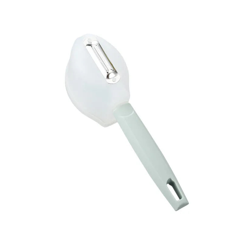 Stainless steel fruit peeler with PP handle, shown in pink or blue, modern minimalist kitchen gadget for fruit peeling