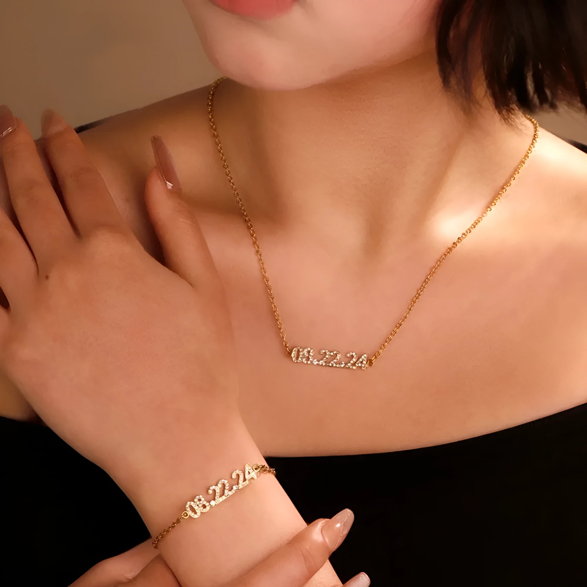 Stainless steel digital bracelet and necklace with diamond-set numbers in gold, rose gold, or steel colour.