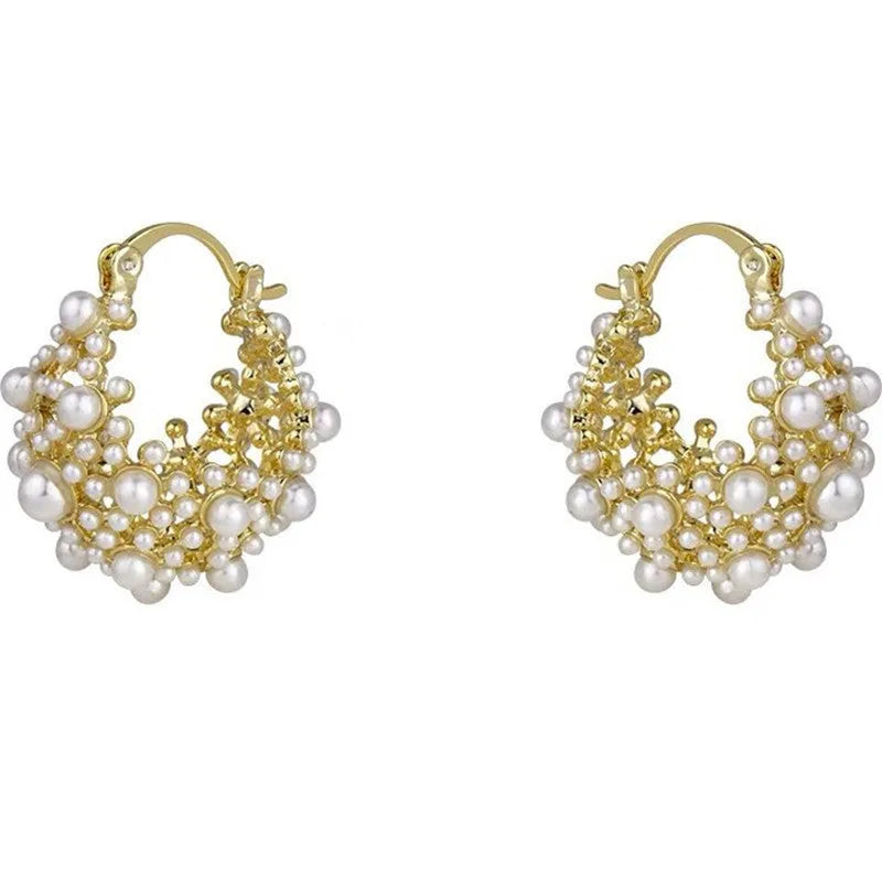 Women's gold copper earrings with floral basket design featuring small beads and pearl inlay detailing