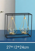Set of six Nordic iron candle holders in various styles for block candles on a wooden shelf