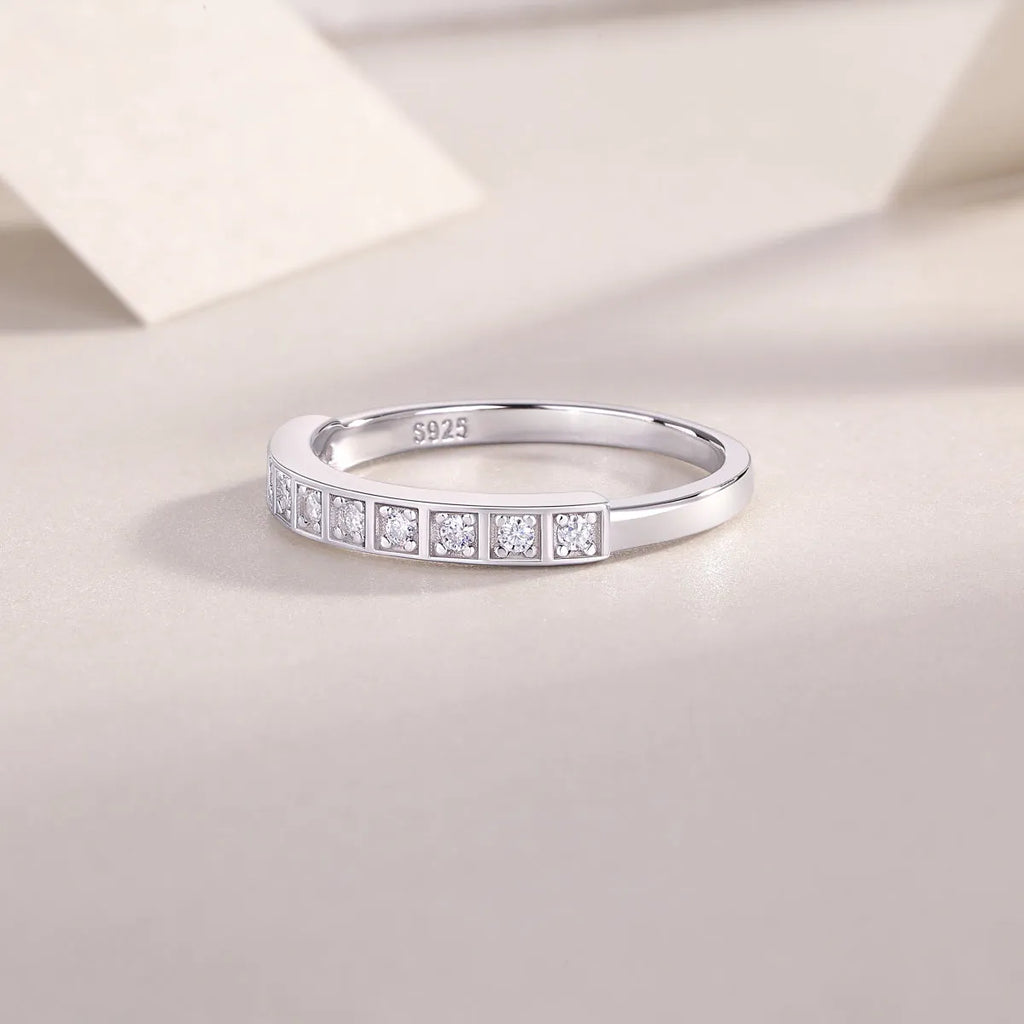 Moissanite wedding ring set on white background, S925 silver platinum plated, less than 0.1 carat stone