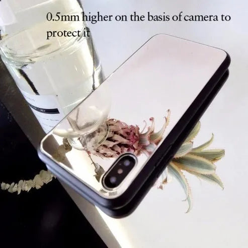 Black iPhone back cover case with a reflective mirror surface and self-timer function.
