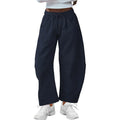 Loose cropped sweatpants with drawstring waist and side pockets in street fashion styling