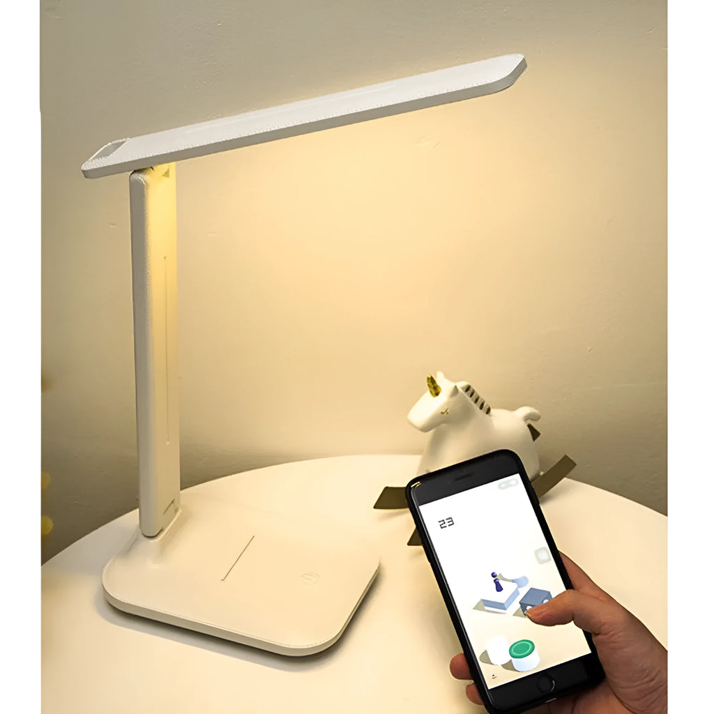 White plastic touch dimming bedside lamp with USB charging cable.