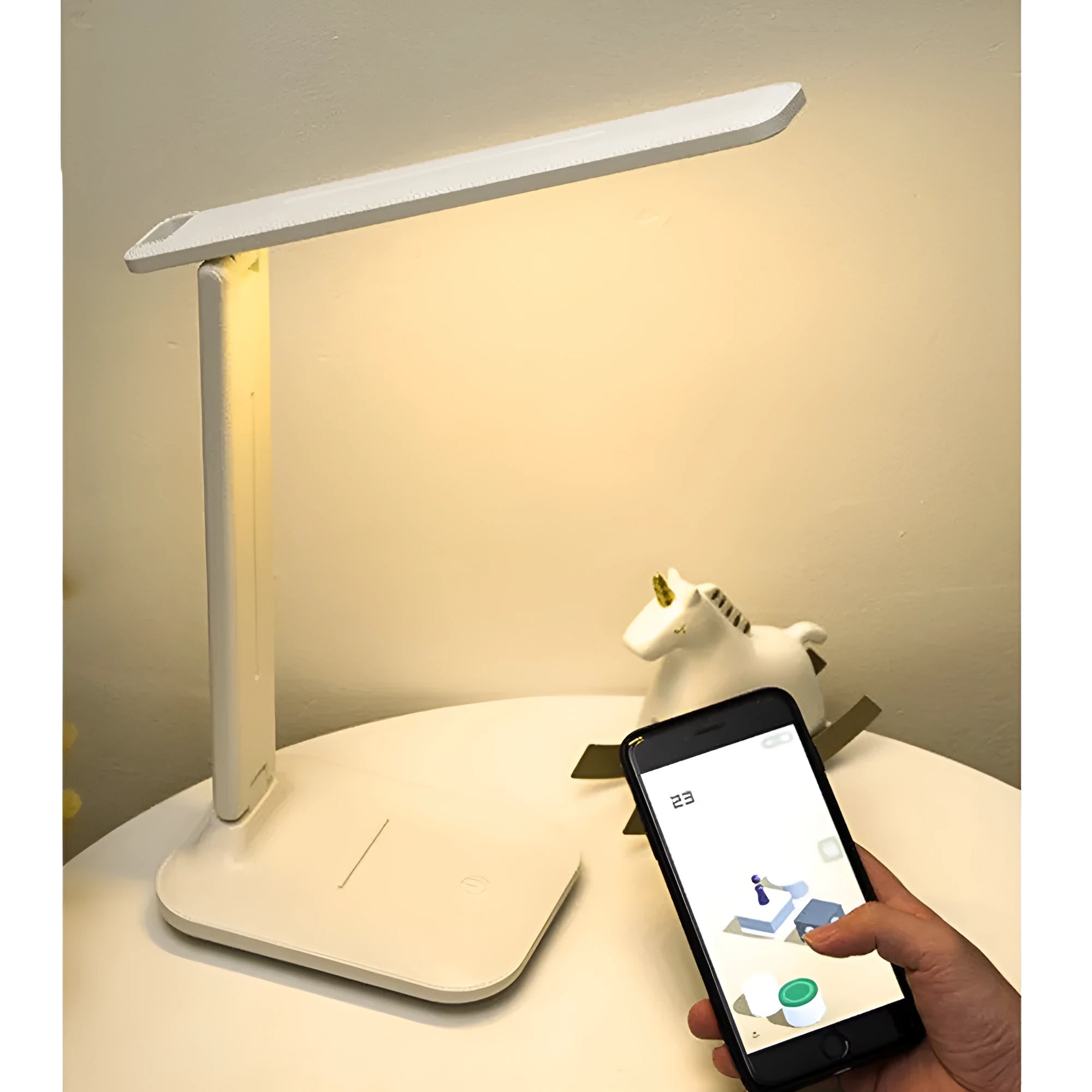 White plastic touch dimming bedside lamp with USB charging cable.