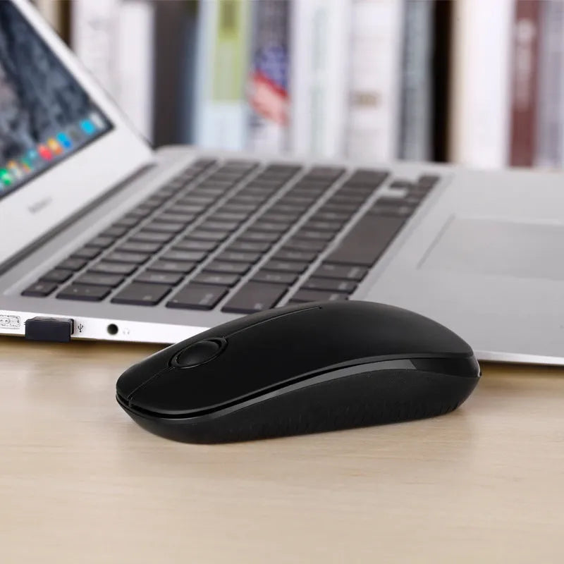 Black 2.4G wireless mouse with compact dimensions 120x66x36mm on desk