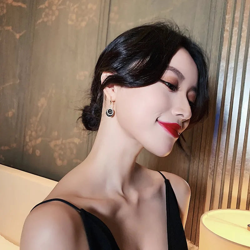 Black alloy geometric drop earrings with circular retro Hong Kong design, 3.6cm length