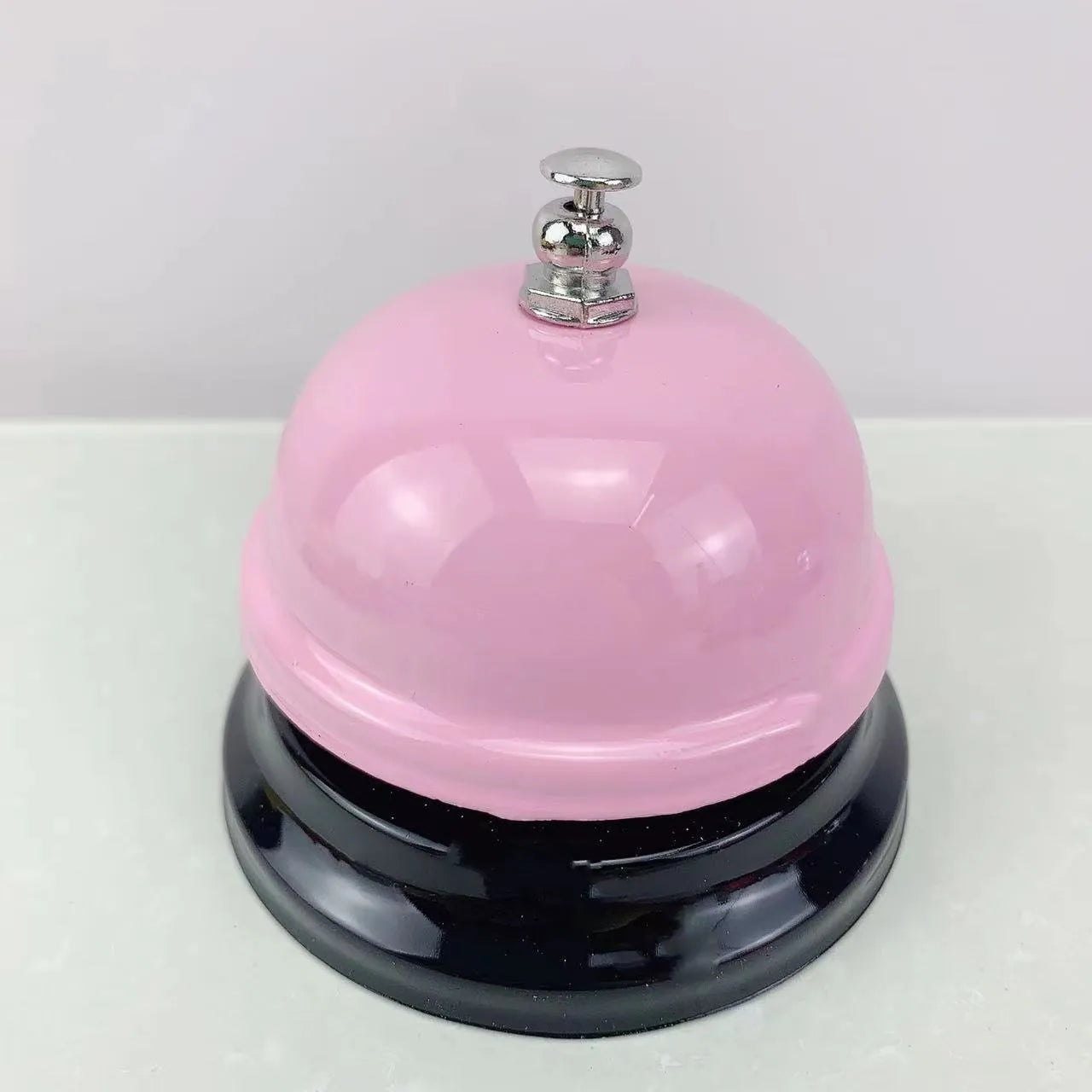 Iron handheld bell in selected colour for classroom games or restaurant service.