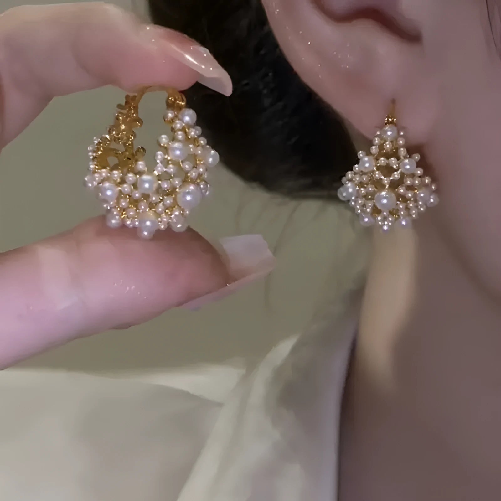 Women's gold copper earrings with floral basket design featuring small beads and pearl inlay detailing