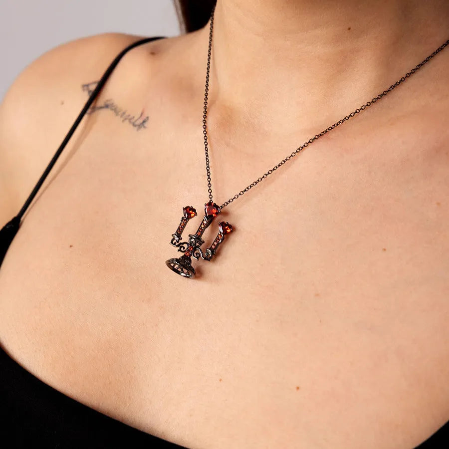 Gothic women's necklace with hollow candlestick pendant on a cross chain in retro finish.