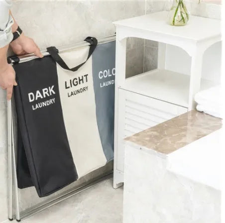 Grey foldable 3-compartment laundry basket with Oxford cloth body and aluminium frame
